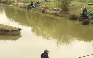 Fisherman fishing at lake