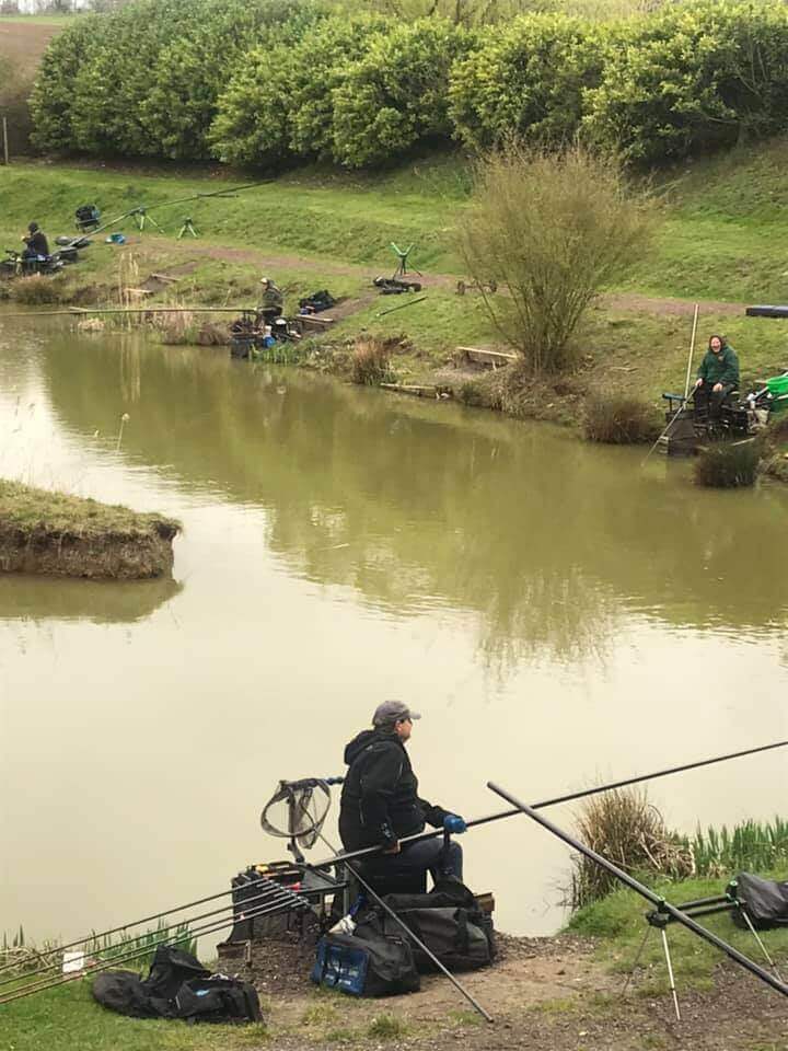 Fisherman fishing at lake